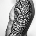A black and white geometric pattern on an arm sleeve showcasing intricate designs and bold contrasts.
